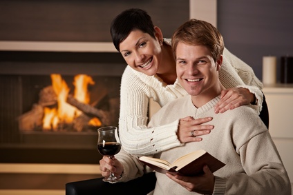 Couple enjoying wine and book